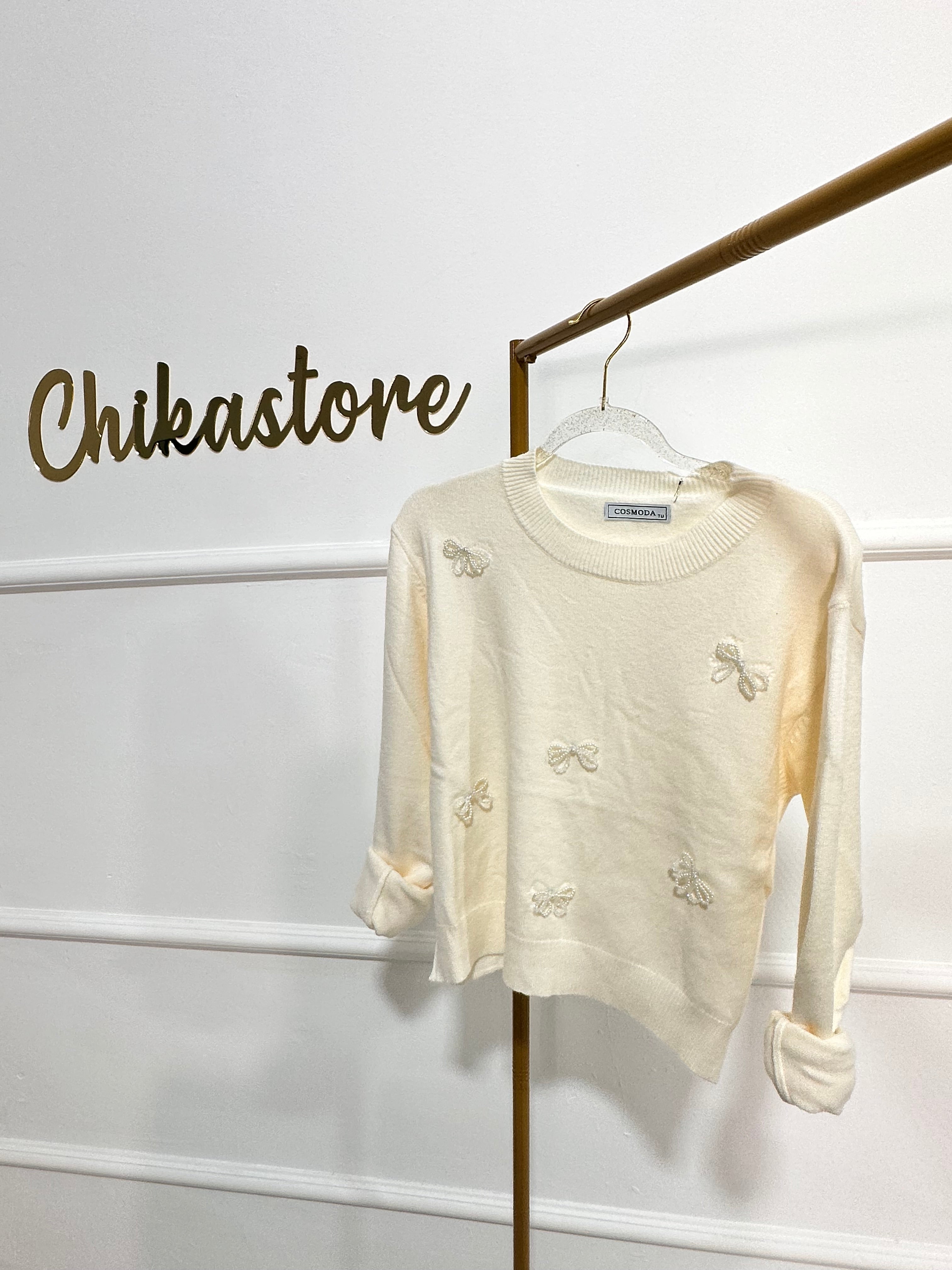 Pull con fiocchi in perline