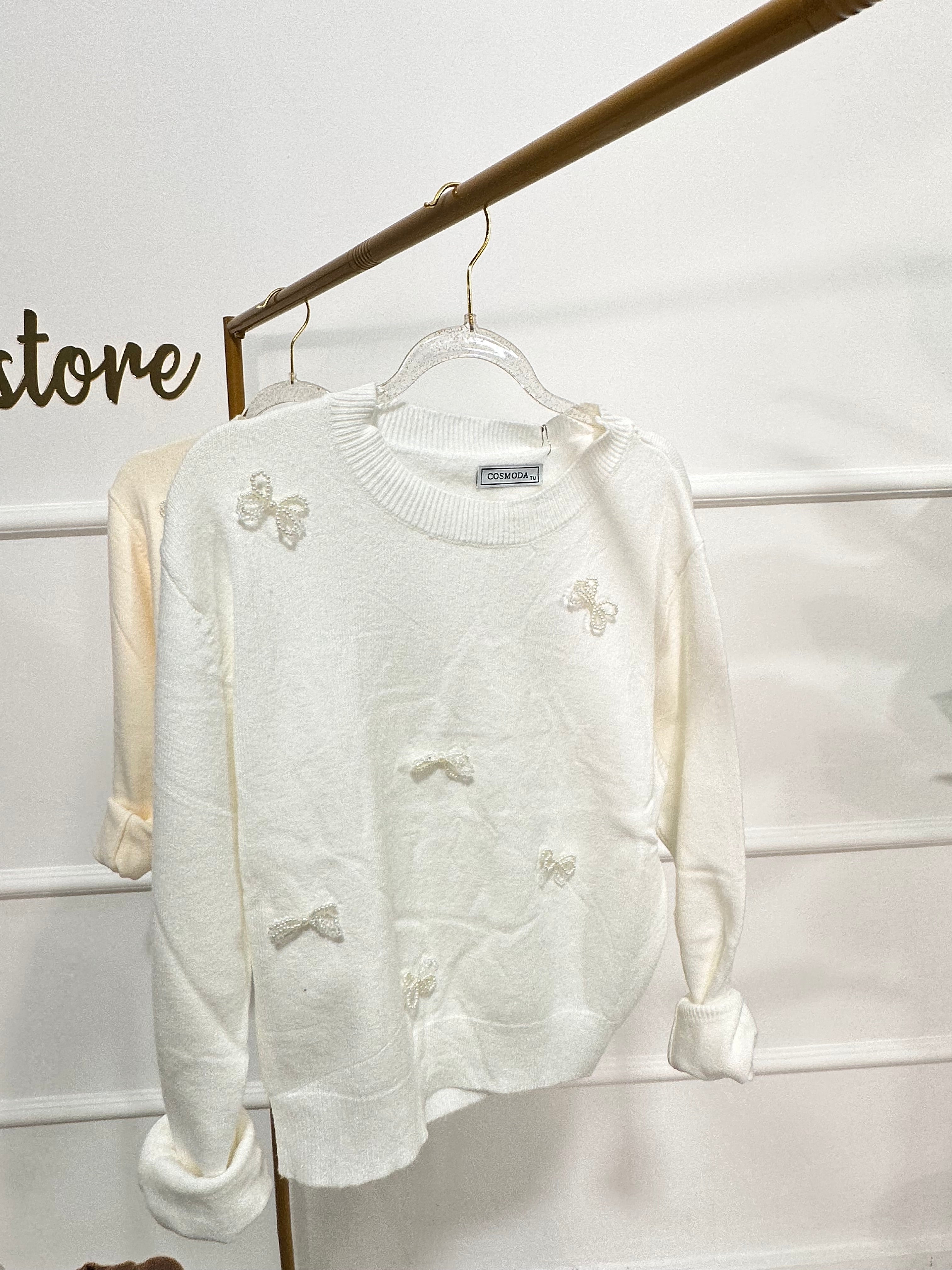Pull con fiocchi in perline